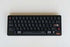 Wukds Interstellar keycaps in zwart met witte en rode details op een mechanisch toetsenbord